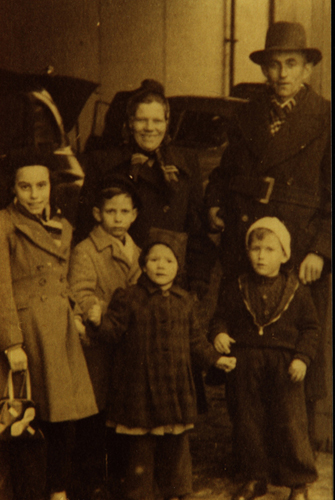 Douwsma family prior to boarding the S.S. Zuiderkruis , 22 January 1952. Canadian Museum of Immigration at Pier 21 (DI2013.1530.9).