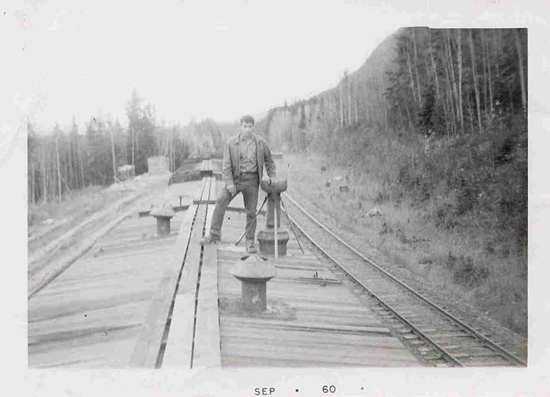 Giuseppe Piccolo on top of train in British Columbia, 1960. Canadian Museum of Immigration at Pier 21 (DI2013.1898.4).