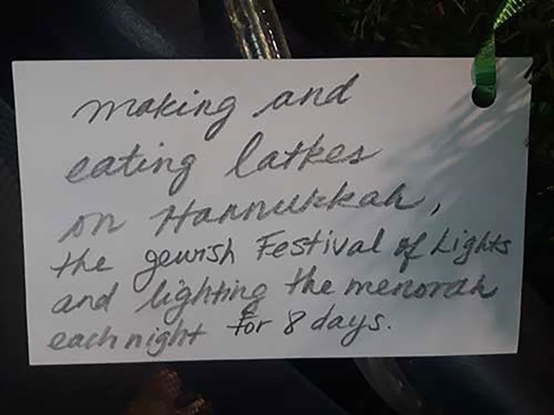 Making and eating latkes on Hannukah, the Jewish Festival of Lights, and lighting the menorah each night for eight days.