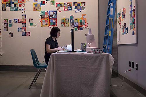 Andrea is working on the quilt