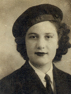 Head and shoulder portrait of a young woman wearing a military beret.