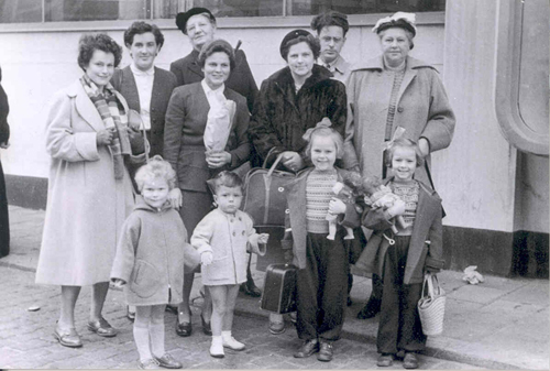 Arie & Tiny Bor with family, on the dock in Rotterdam. Canadian Museum of Immigration at Pier 21 (DI2013.1535.3).