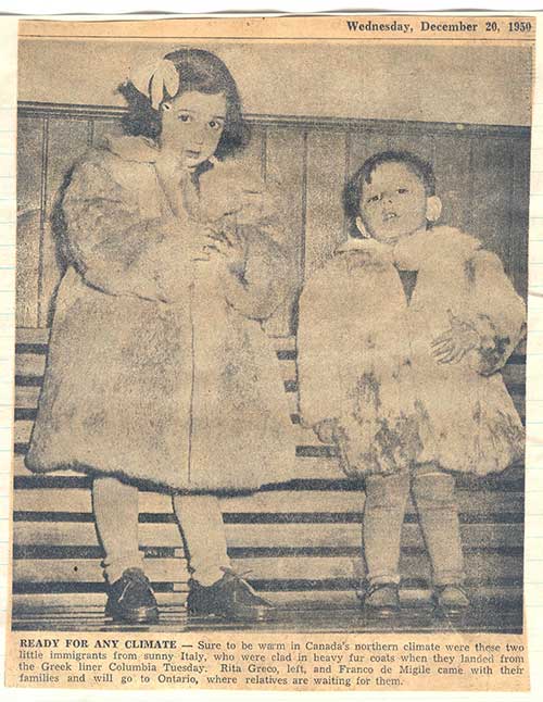 Newspaper clipping from scrapbook featuring children Rita Greco and Franco de Migile arriving in Canada sporting winter coats. Canadian Museum of Immigration at Pier 21 (R2014.336.1).