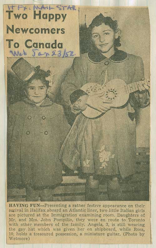 Detail of newspaper clipping from scrapbook featuring Angela and Rosa Pompilio in the Immigration examining room, 1952. Canadian Museum of Immigration at Pier 21 (R2014.336.1).
