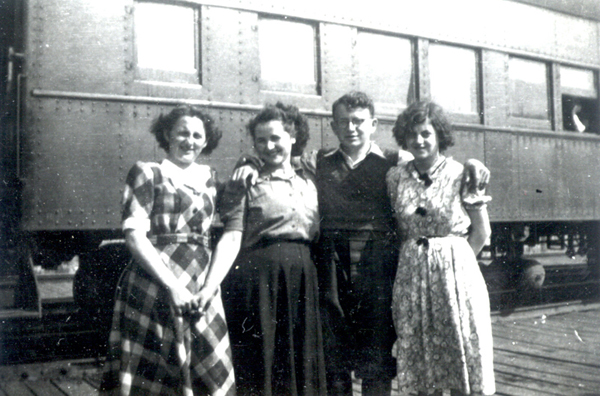 Betty, John, & Bernadette Timmerman boarding a train at Pier 21. Canadian Museum of Immigration at Pier 21 (DI2013.1529.8).
