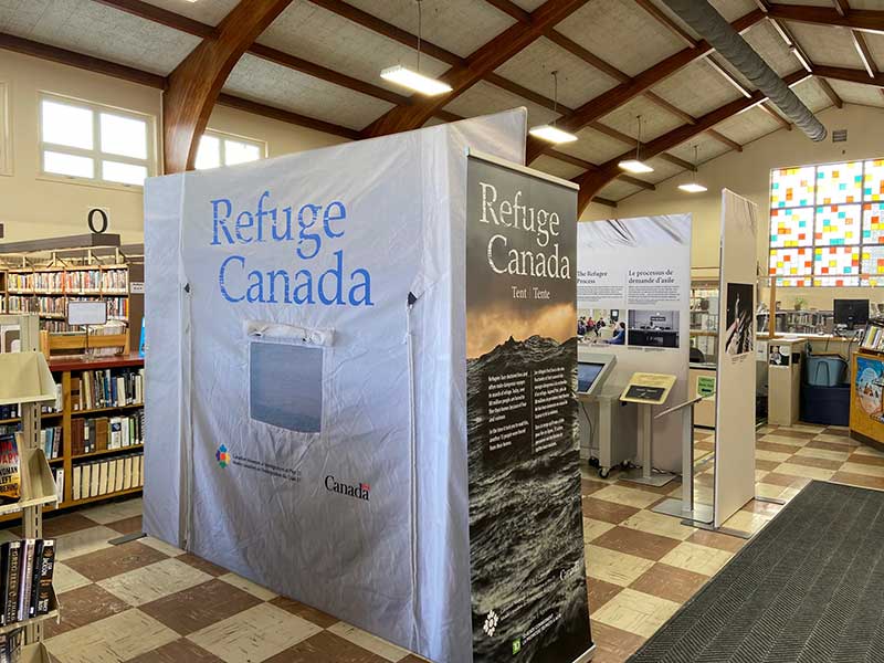 Popup banner with Refuge Canada written out over a background of a dark and stormy sea.